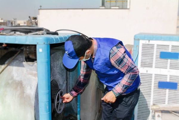 The man who is repairing the water cooler